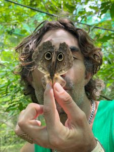 Owl Butterfly over mans face