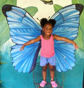 little girl at the butterfly garden costa rica